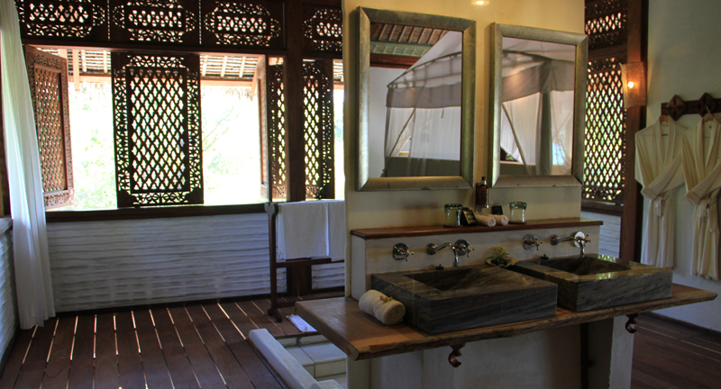 The lovely, open bathroom in our "kitala", complete with Africology bath products made with African essential oils.